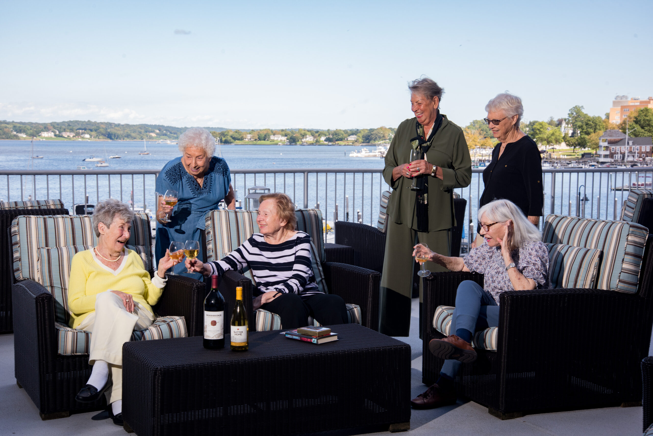 Group of residents enjoying drinks overlooking the Navesink River