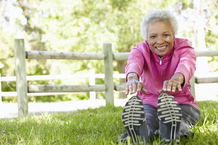 Senior woman exercising as a way to boost her immune health.