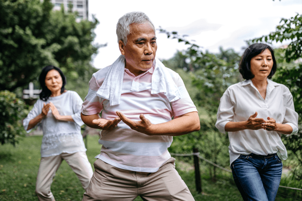 older people practicing tai chi