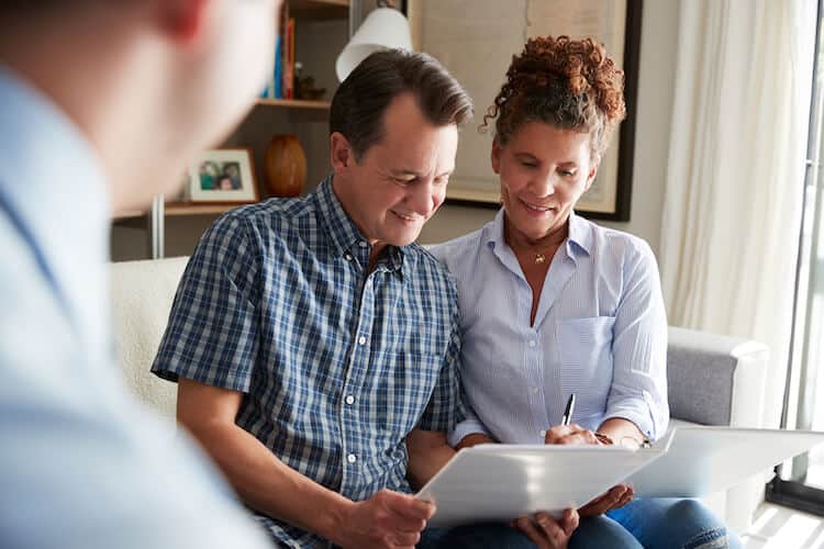 Senior couple meeting with financial advisor.