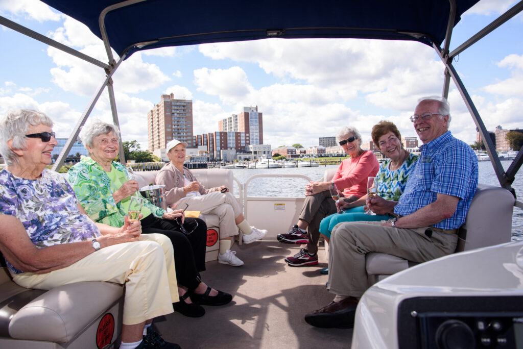 Several Residents taking a boat ride on a sunny day