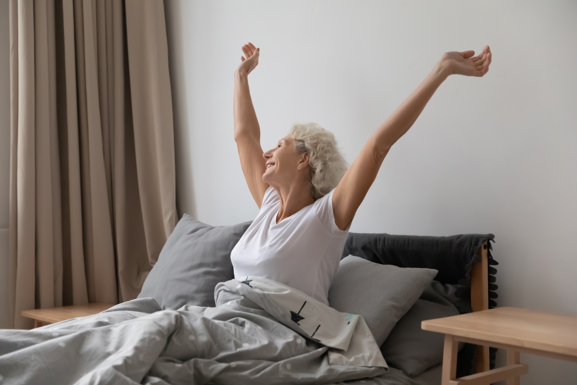 Happy senior woman doing her morning stretch