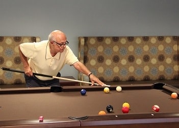 Senior man playing pool