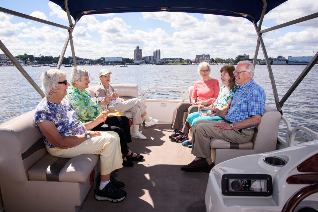 Seniors enjoying a pontoon boat ride