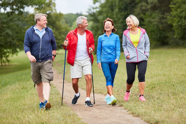 A group of happy seniors taking a walk.