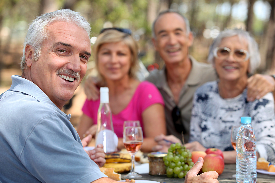 Older adults enjoying lunch outdoors in Red Bank, NJ