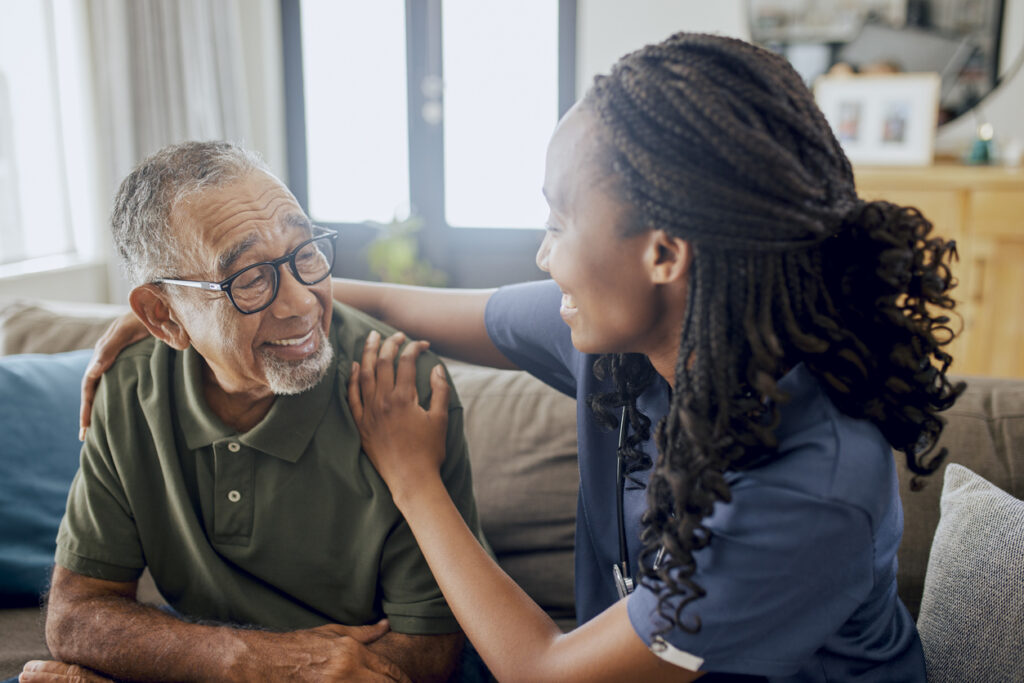 Nurse and Male Patient Smiling at Each Other