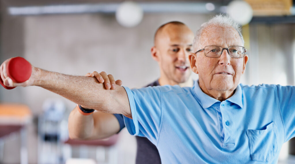 Senior Male Working with Physical Therapist